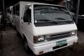 Selling White Mitsubishi L300 2012 Manual Diesel in Quezon City -1