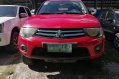 Red Mitsubishi Strada 2011 at 67000 km for sale -2