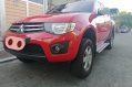 Sell Red 2013 Mitsubishi Strada in Quezon City -1
