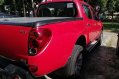 Red Mitsubishi Strada 2011 at 67000 km for sale -4