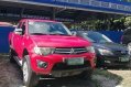 Red Mitsubishi Strada 2011 at 67000 km for sale -0
