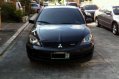 Sell Black 2009 Mitsubishi Lancer in Quezon City-0