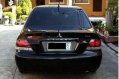 Sell Black 2009 Mitsubishi Lancer in Quezon City-1