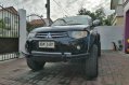 Sell Black 2012 Mitsubishi Strada in Bamban-0