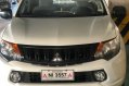 Selling White Mitsubishi Strada 2016 in Caloocan-0