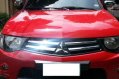 Red Mitsubishi Strada 2012 Truck for sale in Talisay City-0
