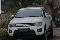 White Mitsubishi Strada 2012-0