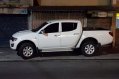  White Mitsubishi Strada 2012-4