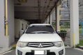 Selling White Mitsubishi Strada 2012 in Makati-1