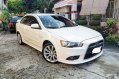 Selling Pearl White Mitsubishi Lancer 2010 in Quezon City-0