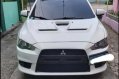 Pearl White Mitsubishi Lancer 2010 for sale in Quezon City-7