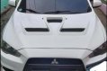 Pearl White Mitsubishi Lancer 2010 for sale in Quezon City-0