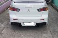 Pearl White Mitsubishi Lancer 2010 for sale in Quezon City-9