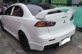 Pearl White Mitsubishi Lancer 2010 for sale in Quezon City-2