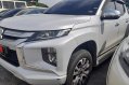 Selling Pearl White Mitsubishi Strada 2020 in Quezon-0