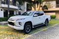 Pearl White Mitsubishi Strada 2019 for sale in Quezon -4