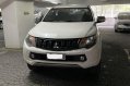 Sell White 2015 Mitsubishi Strada in San Juan-1