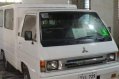 Selling White Mitsubishi L300 2011 in Dasmariñas-0