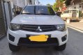 Sell White 2014 Mitsubishi Strada in Makati-0