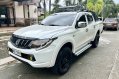 Sell White 2016 Mitsubishi Strada in Quezon City-0