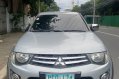 Selling White Mitsubishi Strada 2010 in Quezon City-1