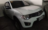 Selling White Mitsubishi Strada 2014 for sale in Pasig