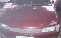 Selling Red Mitsubishi Lancer 1997 Manual Gasoline 