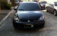 Sell Black 2009 Mitsubishi Lancer in Quezon City