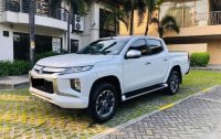 Pearl White Mitsubishi Strada 2019 for sale in Quezon 