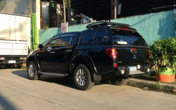 Selling Black Mitsubishi Strada 2010 in Quezon